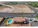 Aerial view of a desert home featuring a custom pool, RV parking, and close proximity to major roadways at 3937 Country Lights St, Las Vegas, NV 89129