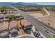This aerial view shows a home with RV parking with close proximity to a highway and neighborhood at 3937 Country Lights St, Las Vegas, NV 89129