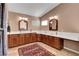 Bright bathroom with double vanities, mirrors, and a beautiful rug at 3937 Country Lights St, Las Vegas, NV 89129
