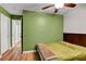 Bright bedroom with wood floors and adjacent doors and hallway views at 3937 Country Lights St, Las Vegas, NV 89129