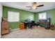 Bright bedroom with neutral carpet, ceiling fan and dual desks, perfect for a home office or studying at 3937 Country Lights St, Las Vegas, NV 89129