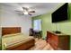 Bedroom with natural light, a ceiling fan, and a comfortable bed at 3937 Country Lights St, Las Vegas, NV 89129