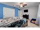 Comfortable bedroom with a large closet, ceiling fan, dresser and television at 3937 Country Lights St, Las Vegas, NV 89129