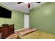 Cozy bedroom with wood floors, and a neutral color scheme with a TV at 3937 Country Lights St, Las Vegas, NV 89129