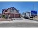 A two-story home with RV parking on a sunny day at 3937 Country Lights St, Las Vegas, NV 89129