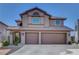 Inviting two-story home boasts a tile roof and spacious two-car garage at 3937 Country Lights St, Las Vegas, NV 89129