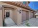 Attached two-car garage and covered walkway on the side of home at 3937 Country Lights St, Las Vegas, NV 89129