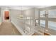 Bright upstairs hallway featuring a staircase and chandelier lighting at 3937 Country Lights St, Las Vegas, NV 89129
