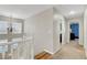 Upstairs hallway with natural light and access to multiple bedrooms at 3937 Country Lights St, Las Vegas, NV 89129