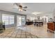 Open kitchen with island, stainless appliances, and backyard pool view at 3937 Country Lights St, Las Vegas, NV 89129