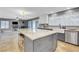 Open kitchen featuring a granite island and stainless appliances at 3937 Country Lights St, Las Vegas, NV 89129