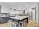 Bright kitchen with granite island, stainless appliances, and modern cabinetry at 3937 Country Lights St, Las Vegas, NV 89129