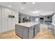 Spacious kitchen with a granite island, stainless appliances, and ample storage at 3937 Country Lights St, Las Vegas, NV 89129