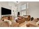Bright living room with high ceilings, decor, and modern laminate flooring at 3937 Country Lights St, Las Vegas, NV 89129