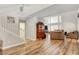Living room boasts natural light, wood floors, and access to a staircase at 3937 Country Lights St, Las Vegas, NV 89129
