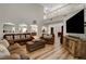 Bright living room with high ceilings and wood laminate flooring at 3937 Country Lights St, Las Vegas, NV 89129
