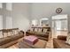 Bright living room with high ceilings and laminate wood flooring at 3937 Country Lights St, Las Vegas, NV 89129
