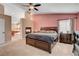 Main bedroom with fireplace, ceiling fan, natural light, and a bathroom view at 3937 Country Lights St, Las Vegas, NV 89129
