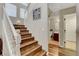Staircase leads to the upper level with a view of the downstairs bathroom at 3937 Country Lights St, Las Vegas, NV 89129