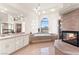 Bright primary bathroom boasting a bathtub, natural light, and sleek finishes at 4 Via Vittorio Pl, Henderson, NV 89011