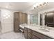 Bathroom with marble countertops, ample storage, and a large mirror at 4 Via Vittorio Pl, Henderson, NV 89011
