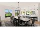 Open concept dining area flows to kitchen and sitting area at 4 Via Vittorio Pl, Henderson, NV 89011