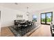 Bright dining room with large table, modern chandelier, and scenic views at 4 Via Vittorio Pl, Henderson, NV 89011