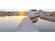 Lakefront dock with a boat, offering serene views and private access to the water at 4 Via Vittorio Pl, Henderson, NV 89011