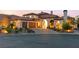 Elegant two-story home with a tile roof, arched entryway, and a well-manicured front yard at 4 Via Vittorio Pl, Henderson, NV 89011