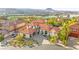 Gorgeous Mediterranean-style home with a red tile roof, manicured landscaping, and spacious three car garage at 4 Via Vittorio Pl, Henderson, NV 89011