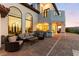 Backyard patio area with outdoor seating and a view of the mountains in the distance at 4 Via Vittorio Pl, Henderson, NV 89011