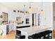 Modern kitchen features white cabinetry, stainless appliances, dual islands, and a breakfast bar with seating at 4 Via Vittorio Pl, Henderson, NV 89011