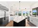 Open kitchen with large island, stainless appliances, and views of the landscape at 4 Via Vittorio Pl, Henderson, NV 89011