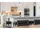 Modern kitchen with large center island, breakfast bar, and stainless steel appliances at 4 Via Vittorio Pl, Henderson, NV 89011