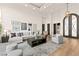 Spacious living room showcasing an open concept, hardwood floors, and bright natural light at 4 Via Vittorio Pl, Henderson, NV 89011