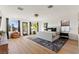 Spacious main bedroom features light wood floors, and access to backyard at 4 Via Vittorio Pl, Henderson, NV 89011