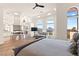 Bright main bedroom featuring hardwood floors, a fireplace, and large windows with a mountain view at 4 Via Vittorio Pl, Henderson, NV 89011