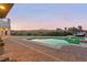 Resort-style pool and spa, perfect for relaxation with sunset views and lush landscaping at 4 Via Vittorio Pl, Henderson, NV 89011