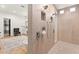 Walk in shower with dual shower heads and tiled accent wall inside the main bathroom at 4 Via Vittorio Pl, Henderson, NV 89011