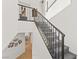 Carpeted staircase with iron railing leads to the upper level at 4 Via Vittorio Pl, Henderson, NV 89011