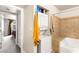 Neat bathroom featuring a stackable washer and dryer, a tiled shower and seating at 4050 Pacific Harbors Dr # 127, Las Vegas, NV 89121