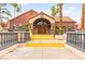 Inviting community clubhouse with a decorative tile roof and desert landscaping at 4050 Pacific Harbors Dr # 127, Las Vegas, NV 89121