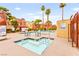 Community hot tub and pool area surrounded by desert landscaping at 4050 Pacific Harbors Dr # 127, Las Vegas, NV 89121