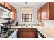 Efficient kitchen with stainless steel appliances, double sink, and updated cabinetry for modern living at 4050 Pacific Harbors Dr # 127, Las Vegas, NV 89121