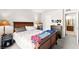 Cozy main bedroom with wood bed frame, bedside tables with lamps, and access to the en-suite bathroom at 4050 Pacific Harbors Dr # 127, Las Vegas, NV 89121