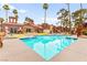 Inviting community pool area with ample seating and desert landscaping at 4050 Pacific Harbors Dr # 127, Las Vegas, NV 89121