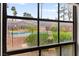 Enjoy the view of the community pool from the window, promising relaxation and leisure at 4050 Pacific Harbors Dr # 127, Las Vegas, NV 89121