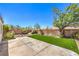 Landscaped backyard featuring a paved patio, artificial turf, mature trees and brick perimeter at 410 Aloha Dr, Henderson, NV 89015