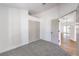 Bedroom with light gray carpet, with a view into a living space, and large closet at 410 Aloha Dr, Henderson, NV 89015