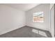 Cozy bedroom featuring neutral walls and carpet and bright natural light at 410 Aloha Dr, Henderson, NV 89015